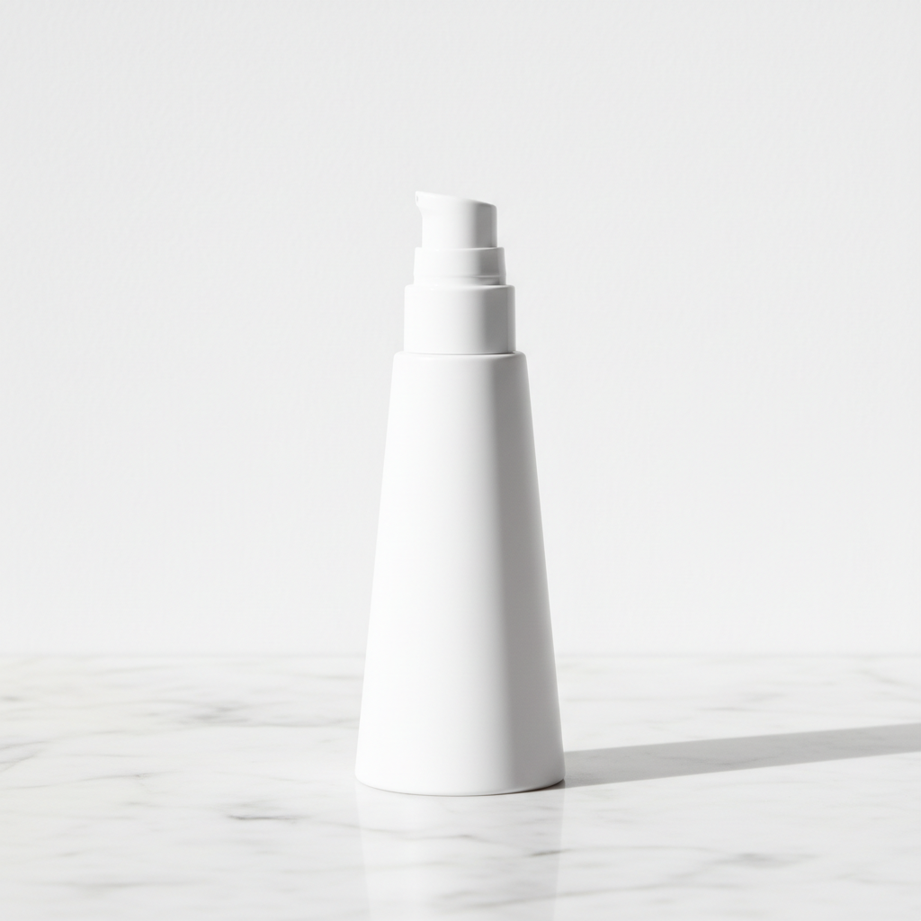 Low side angle view of all-matte white tapered pump bottle showing silhouette profile on white marble