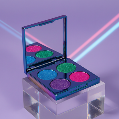 Holographic chrome quad eyeshadow palette open showing electric blue, emerald green, violet and fuchsia glitter pans on acrylic with purple background