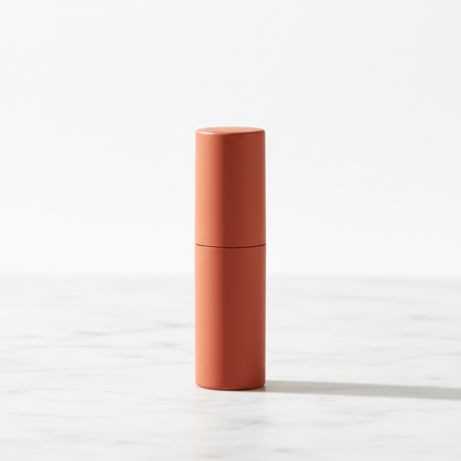 Cylindrical matte lipstick in Terracotta on marble surface